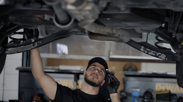 Mechanic inspecting a car engine at an auto repair shop in Langley, BC – House of Cars Auto Repair blog about common car problems